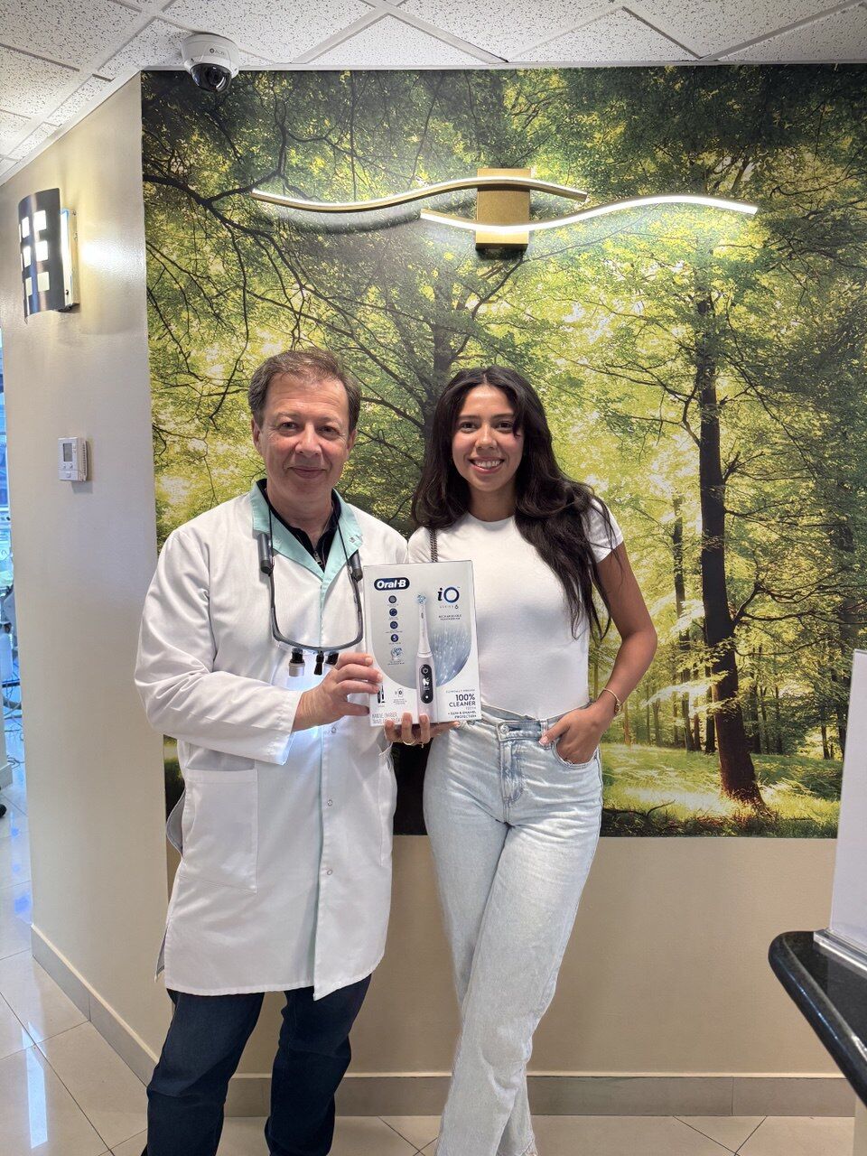 Dr. Boris Lipovetskiy with patient after dental cleaning