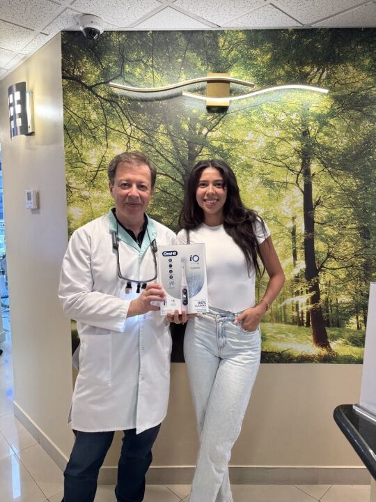 Dr. Boris Lipovetskiy with patient after dental cleaning